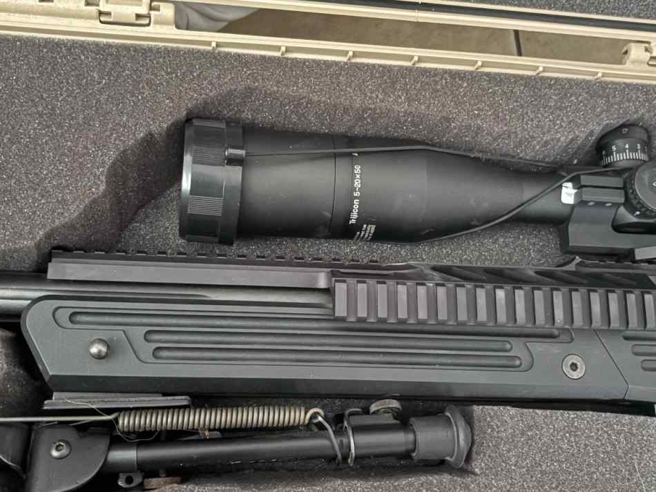 Savage .338 Lapua, with Trijicon 5-20x50 glass.